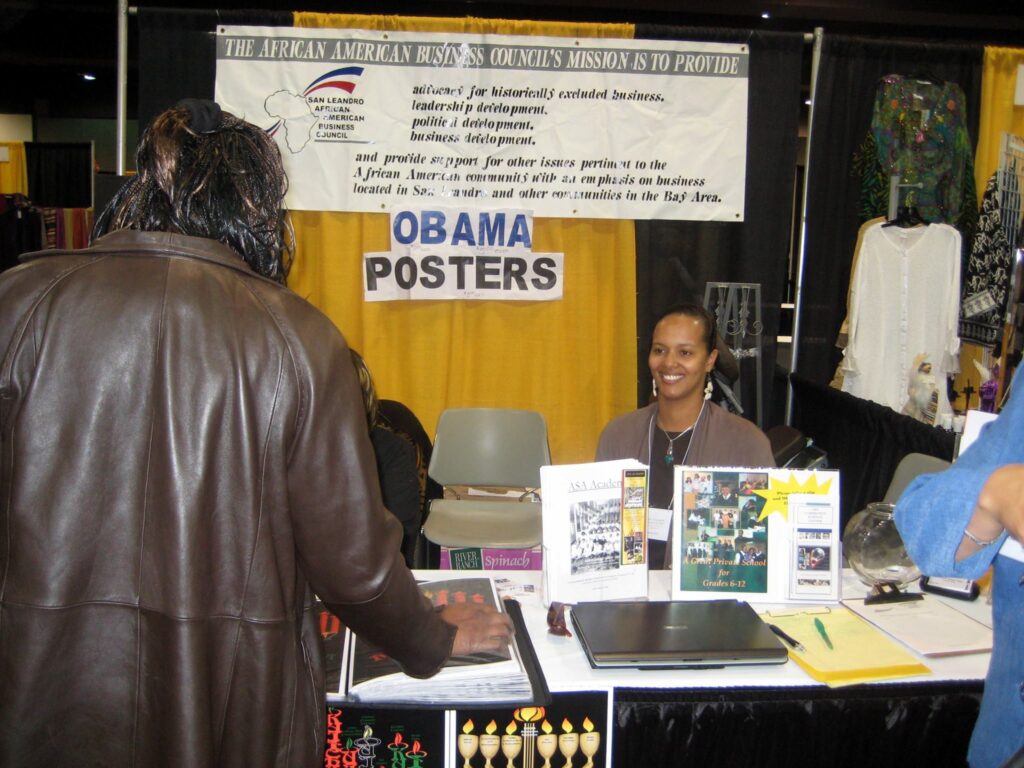 a woman selling Obama posters
